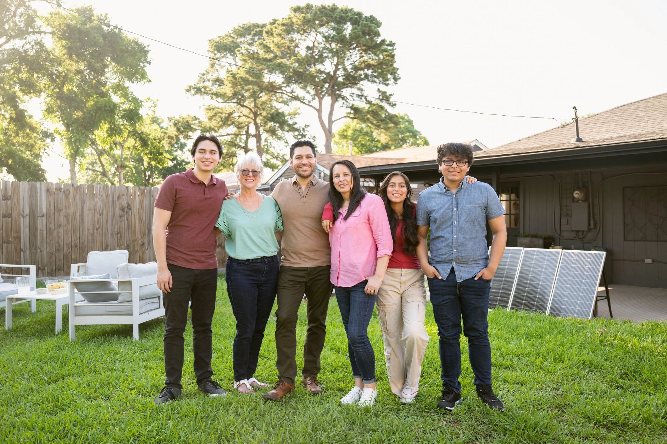 Three-generation family portrait outdoors
