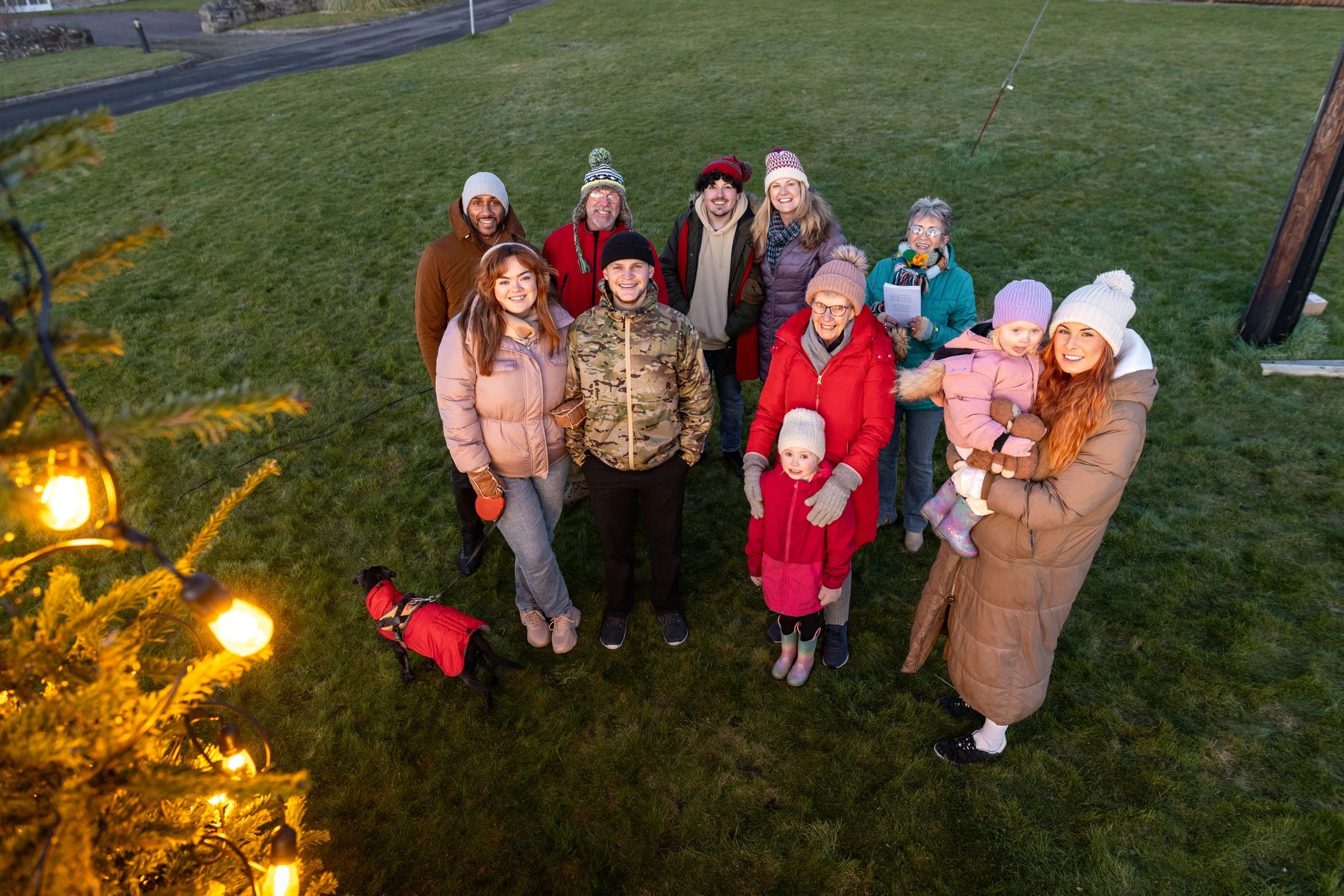 Large group gathered outdoors for a community photo