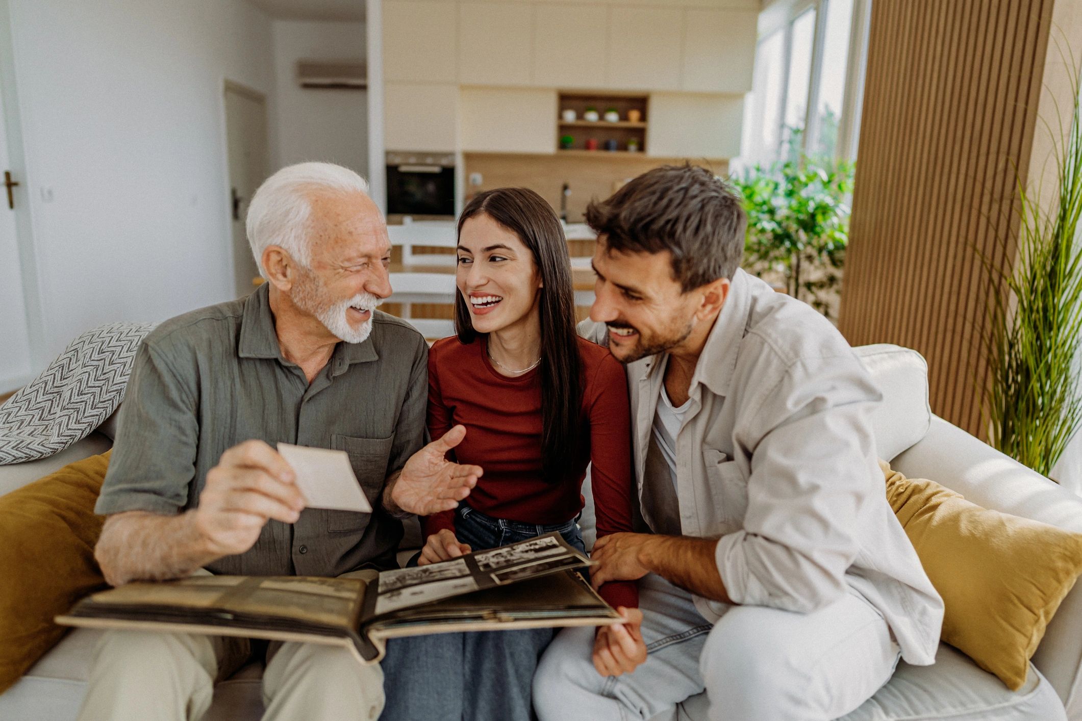 Family sharing memories while viewing old photos